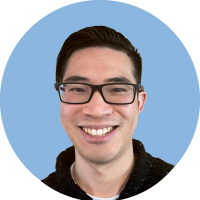 Headshot of Marcus Tang with blue background
