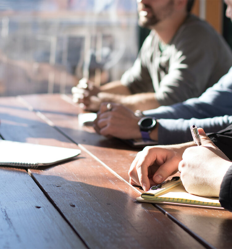 mentor and metnee at a table