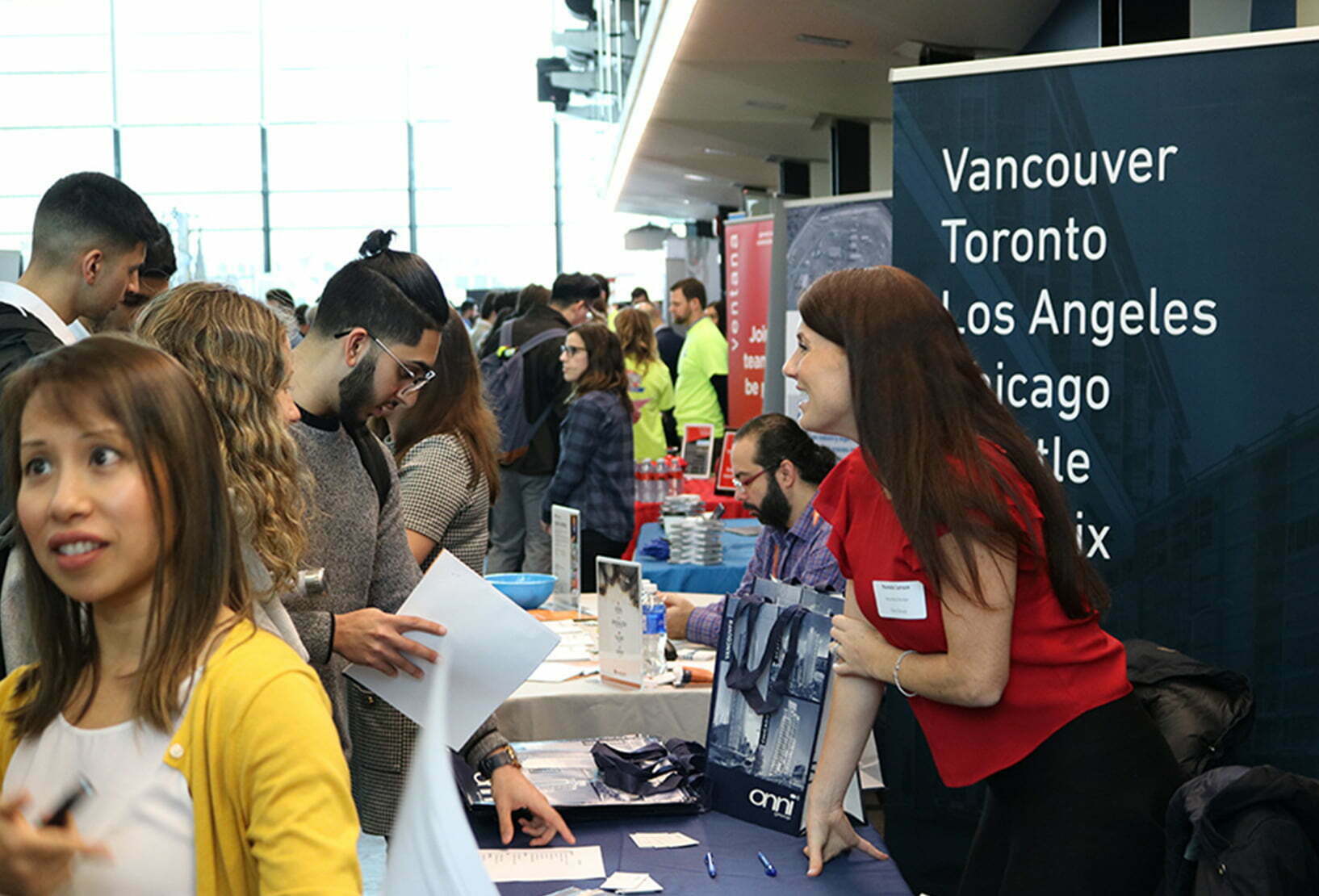 students and employers at a booth