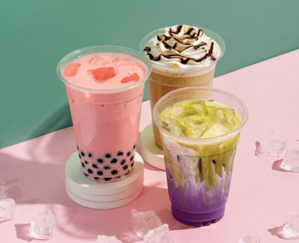 three iced drinks with green and pink background